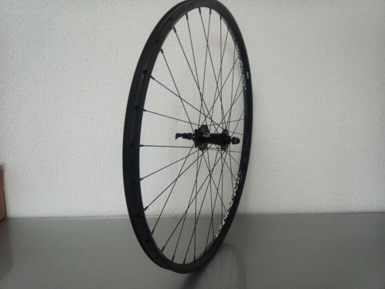 Voorwiel / 622X25C / Rigida - Ryde / Trace 25mm / Zwart / Novatec / D791SB/A /  / 100 MM / Disc (6 bout) / MTB