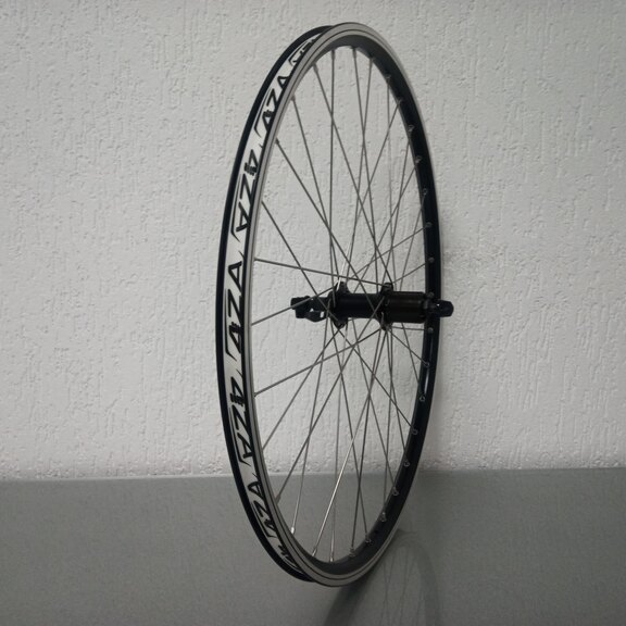 Roue arrière / 559X19C / Rigida - Ryde / ZAC 2000 / Noir / Shimano / FH-T4000 Alivio / HG Body 35 MM / 135 MM / Frein sur jante / VTT - Tour 