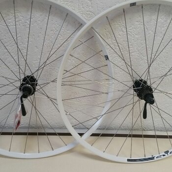 Wielset / 584X21C / Rigida - Ryde / Edge 7 / Wit / Shimano / FH-RM66 & HB-RM65 / HG Body 35 MM  / 135 MM / Disc (Centerlock) / MTB - Tour